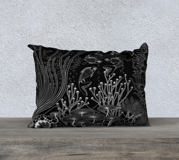 Rectangular black and white art-printed pillow, with images of plants and fish.