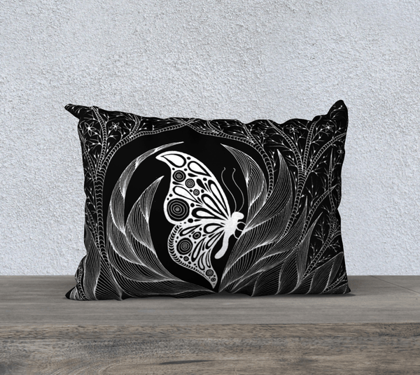 rectangular black and white art-printed pillow with image of a butterfly.